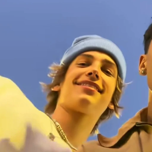 Blue beanie in the Mi Chico Dance source video