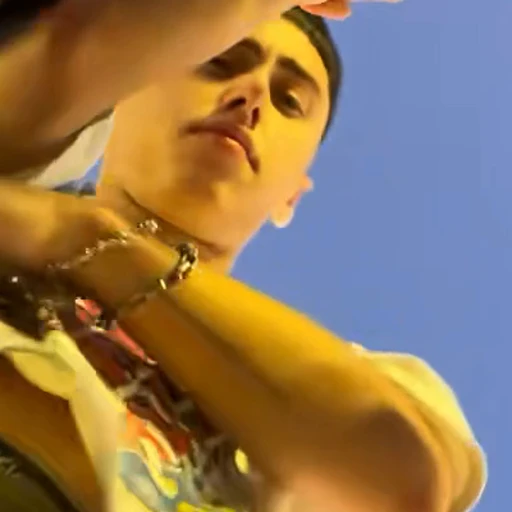 Graphic tee in the Mi Chico Dance source video